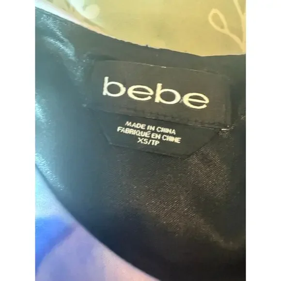 Stunning Bebe fit & flare dress in a vibrant abstract floral print 💜 - Picture 3 of 11